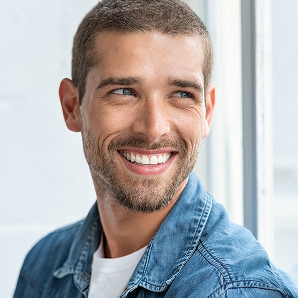 Smiling man at Sirius Orthodontics in Syracuse, Liverpool, Baldwinsville, and Geneva, NY